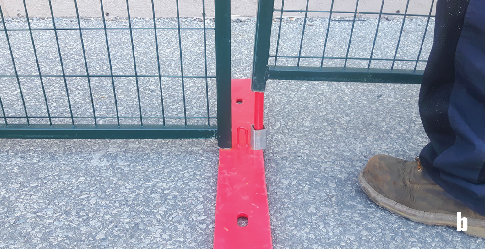 Fence Guy installing fence panel on top of spacer