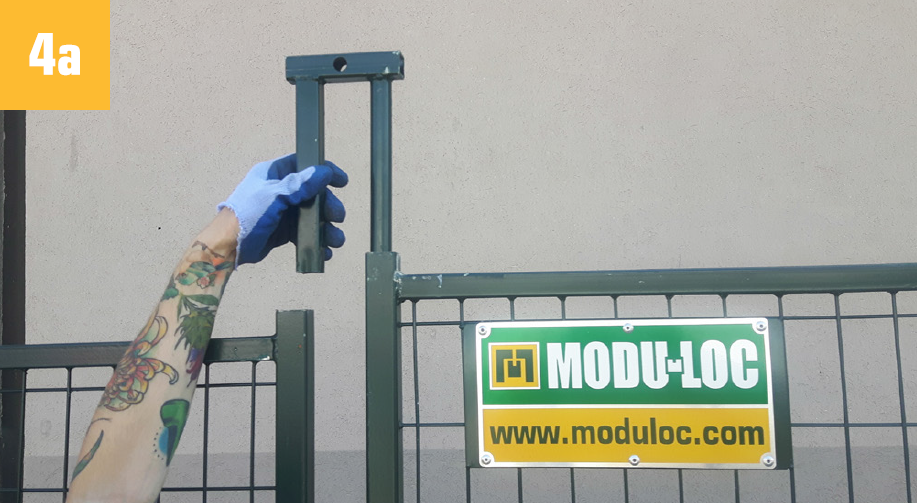 Fence Guy sliding cap into posts to connect two fence panels