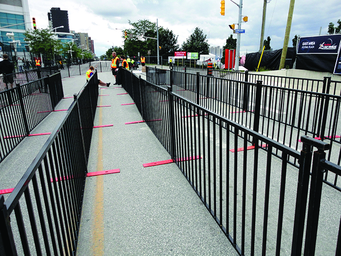 Modu-Loc's black VIP fence is used to create queues at an event