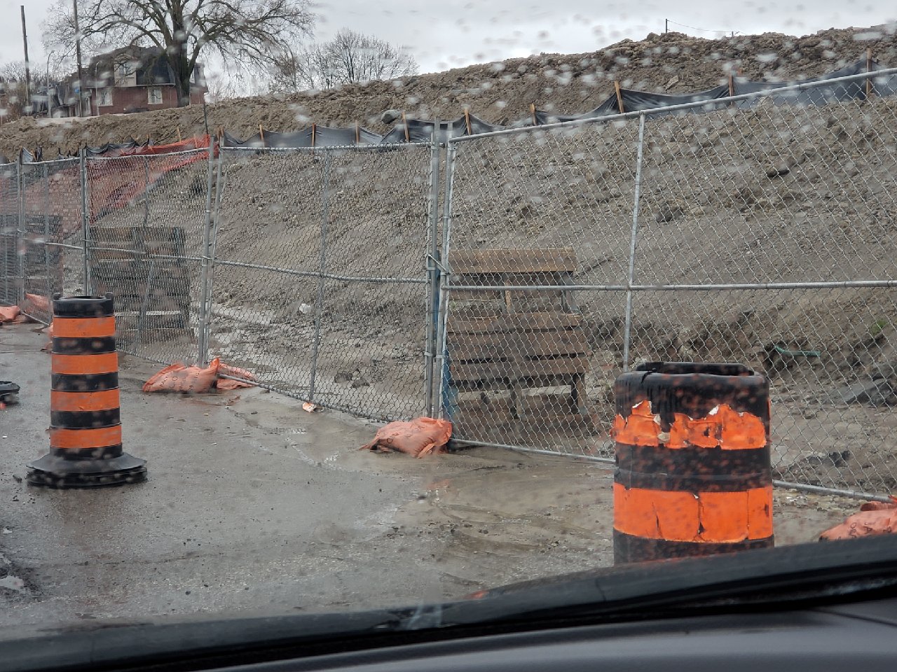 Cheap temporary chain link fence reinforced with sand bags