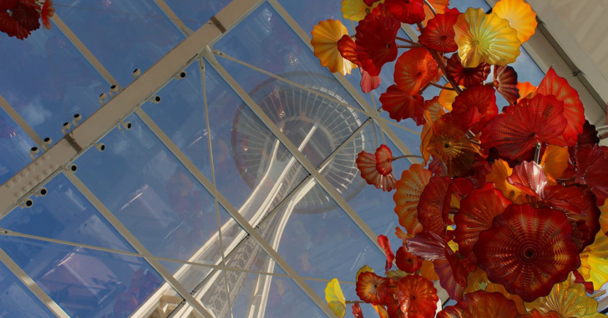 Glass flowers suspended from glass ceiling